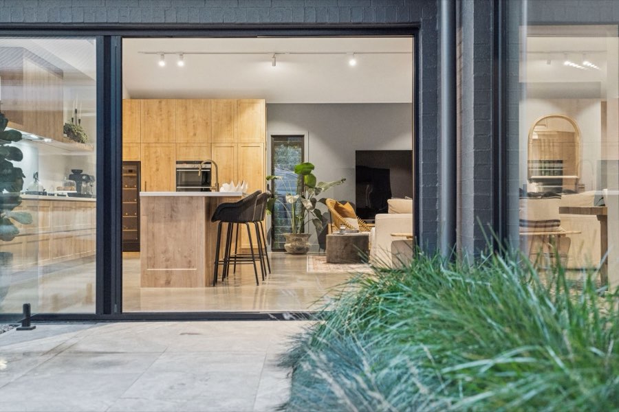 A modern kitchen opening onto the garden in a professionally managed Goulburn home
